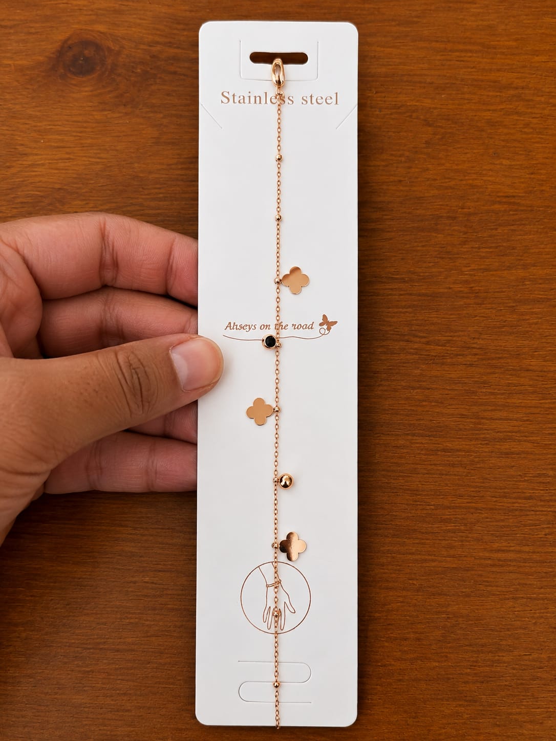 Clover Station Bracelet in rose gold-tone style with small clover-shaped stations spaced along a fine chain