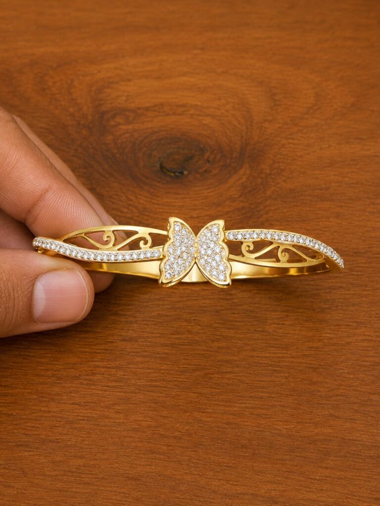 Clear Stone Butterfly Cuff Bracelet in gold-tone style with a clear-stone butterfly centre with open scrollwork sides