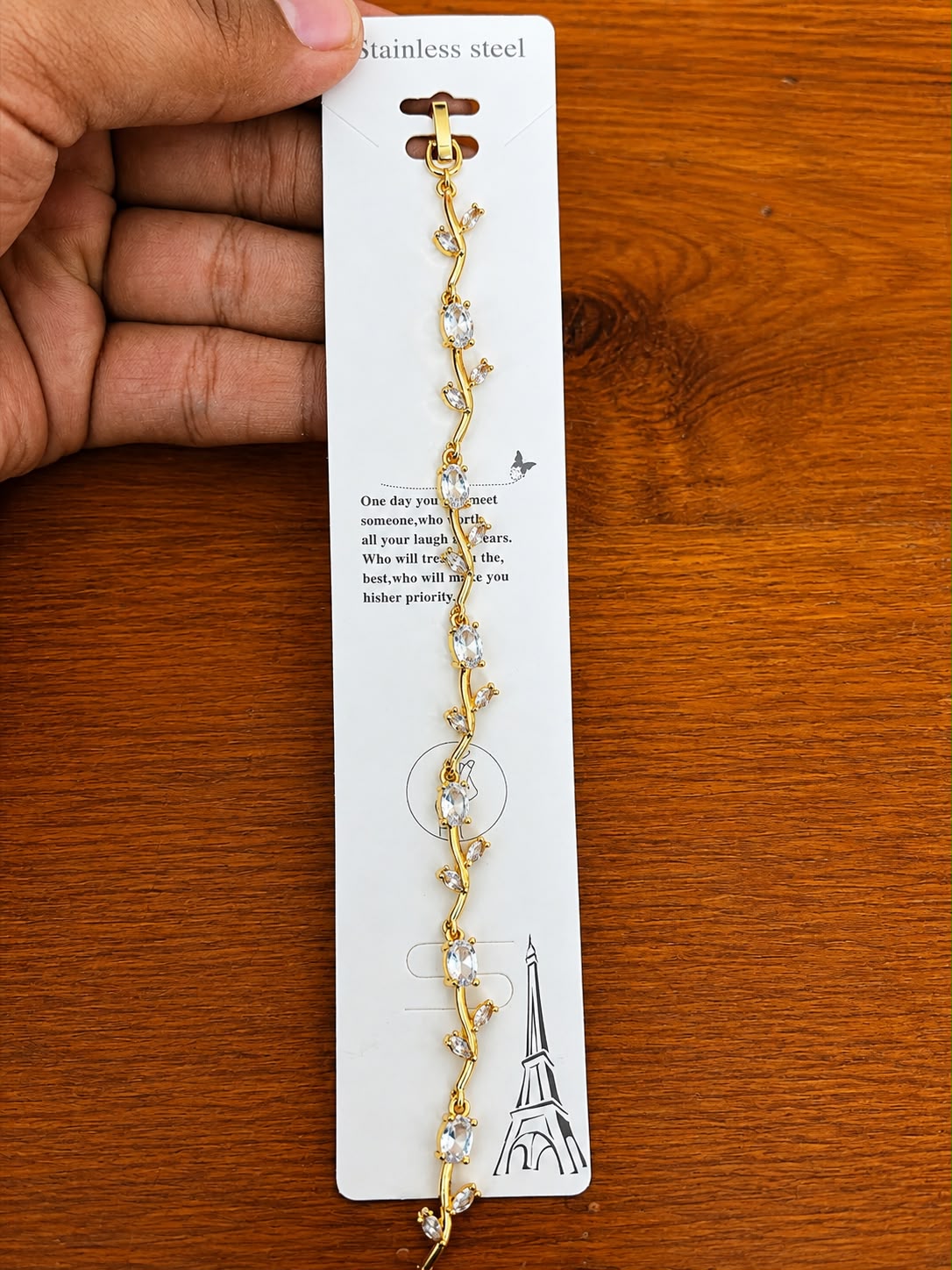 Clear Leaf Bracelet in gold-tone style with clear leaf-shaped accents arranged along a winding vine