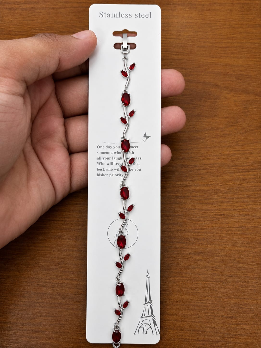 Red Leaf Bracelet in silver-tone style with deep red leaf-shaped accents on a slim vine design