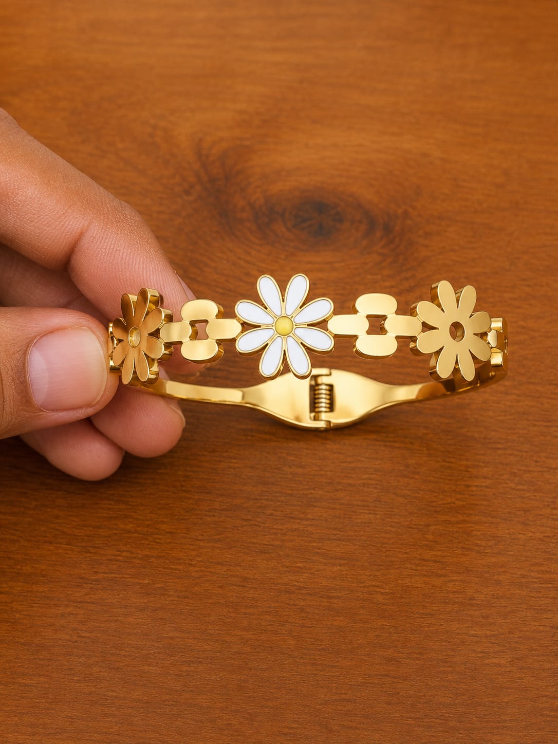 Daisy Cuff Bracelet in gold-tone style with white daisy motifs across an open hinged cuff
