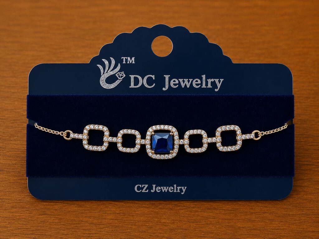 Blue Stone Link Bracelet in silver-tone style with a blue rectangular centre framed by clear rounded-square links