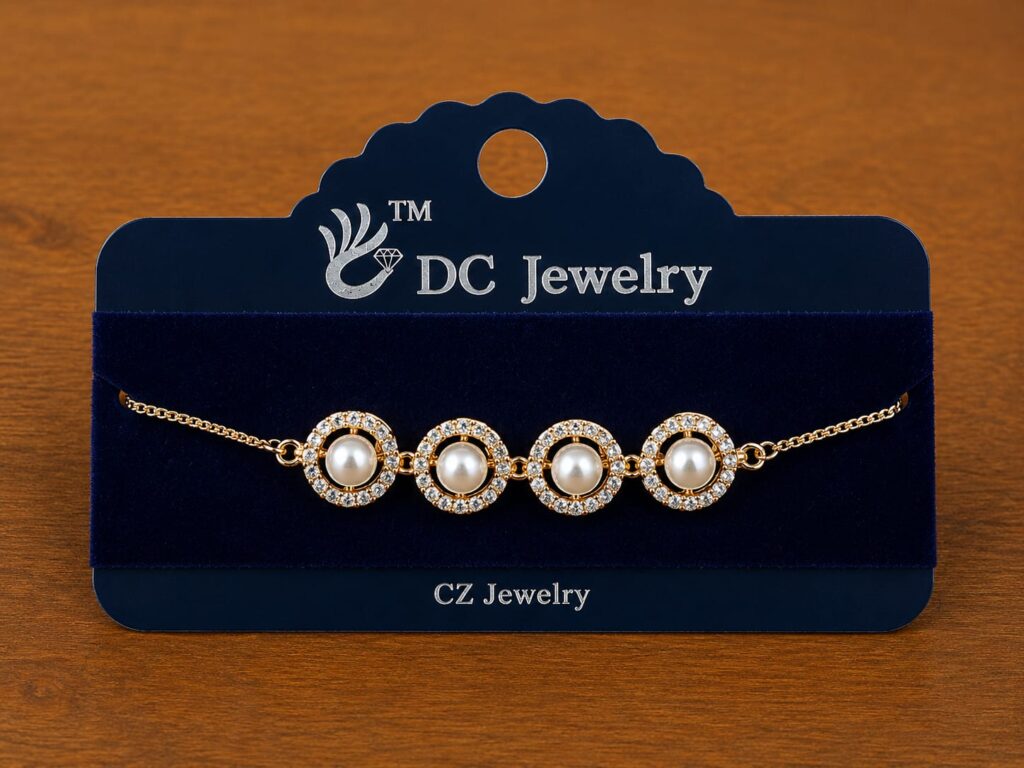 Pearl Halo Bracelet in gold-tone style with four pearl-like round centres surrounded by clear halos