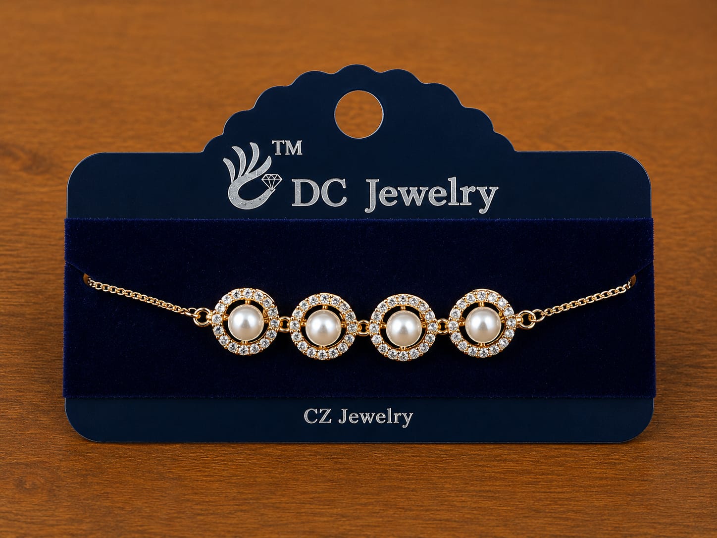 Pearl Halo Bracelet in gold-tone style with four pearl-like round centres surrounded by clear halos
