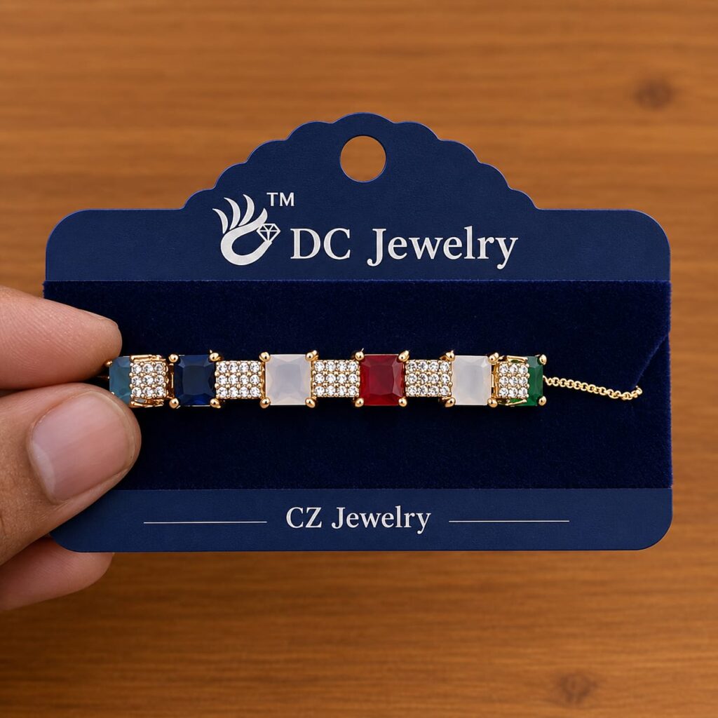 Multicolor Stone Bar Bracelet in gold-tone style with a line of clear, white, red and green rectangular accents