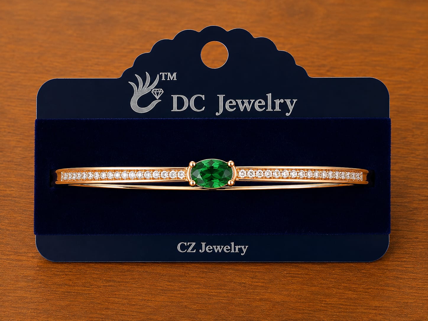 Green Stone Bar Bracelet in gold-tone style with an oval green centre between two rows of clear accents