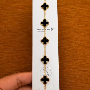 Black Clover Station Bracelet in gold-tone style with five black clover stations spaced along a fine chain