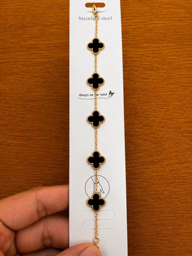 Black Clover Station Bracelet in gold-tone style with five black clover stations spaced along a fine chain