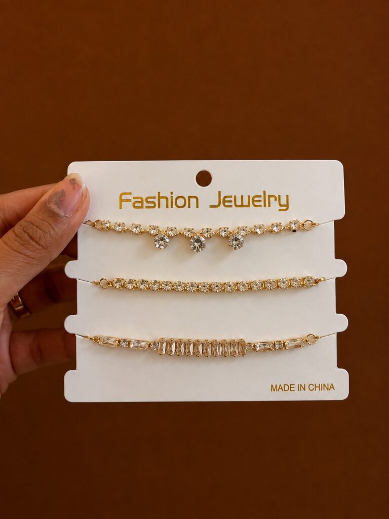 Set of 3 Crystal Chain Bracelets in gold-tone style with three fine bracelets with heart, bar and linked clear details