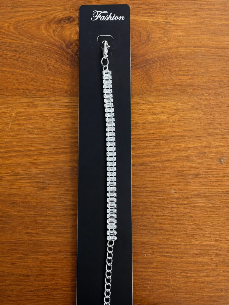 Round Stone Tennis Bracelet in silver-tone style with a continuous line of round clear stone-like accents