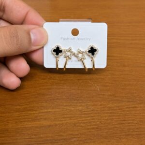 Black Clover Ear Jacket Earrings in gold-tone style with black clover studs with clear star ear-jacket details