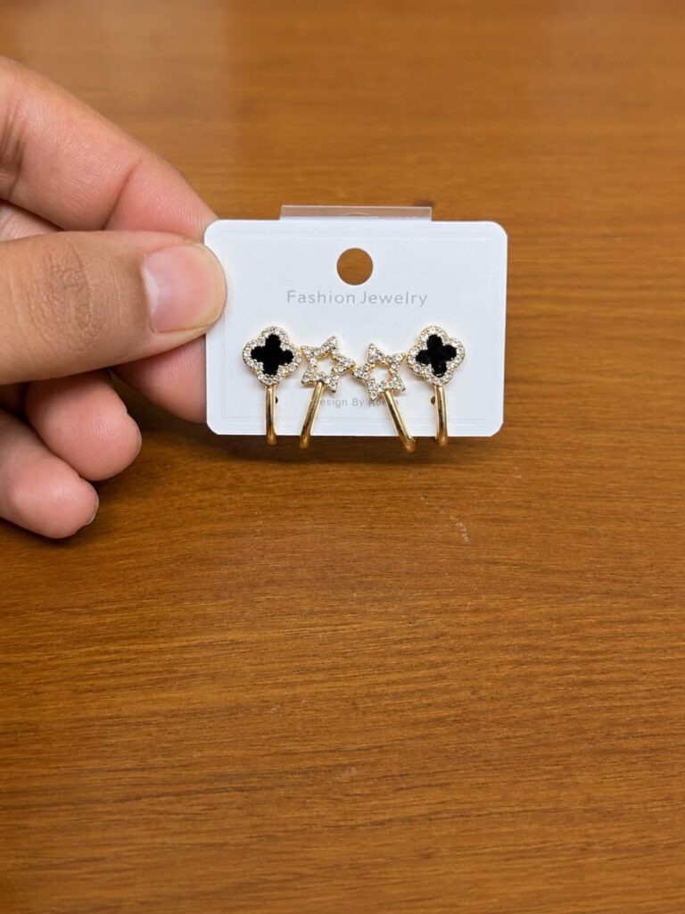 Black Clover Ear Jacket Earrings in gold-tone style with black clover studs with clear star ear-jacket details