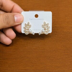 Leaf Cluster Pearl Stud Earrings in gold-tone style with leaf clusters with a pearl-like detail at the base