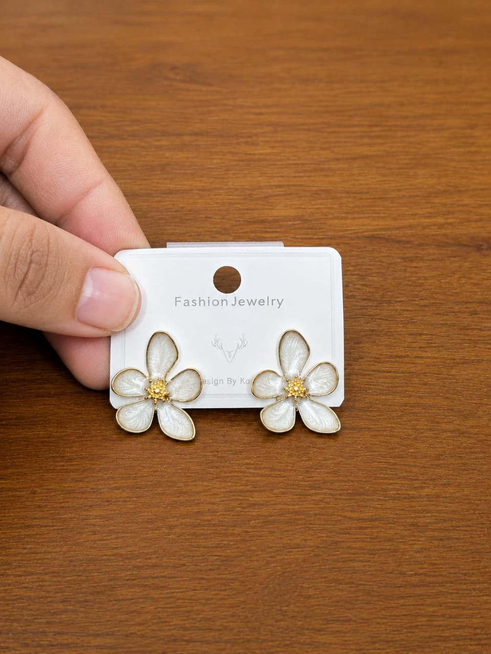 White Daisy Stud Earrings in gold-tone style with five white petals around small warm-toned centres