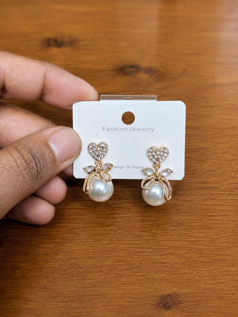 Bow Pearl Drop Earrings in silver-tone style with clear bow-shaped tops with large pearl-like drops