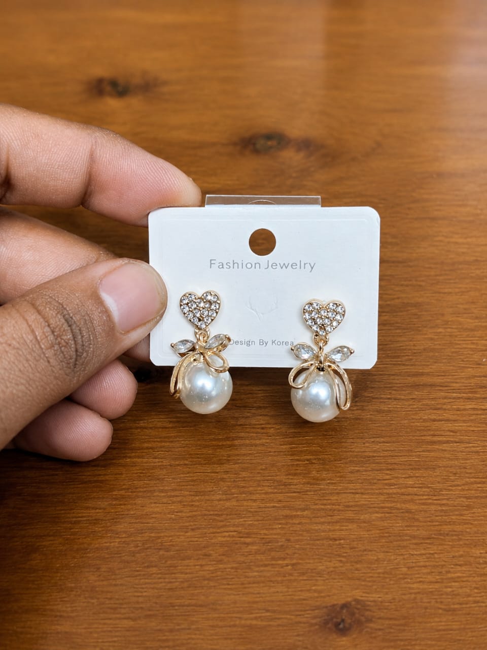 Bow Pearl Drop Earrings in silver-tone style with clear bow-shaped tops with large pearl-like drops