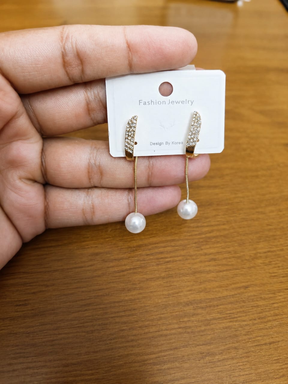 Long Bar Pearl Drop Earrings in gold-tone style with slim clear bars ending in pearl-like drops