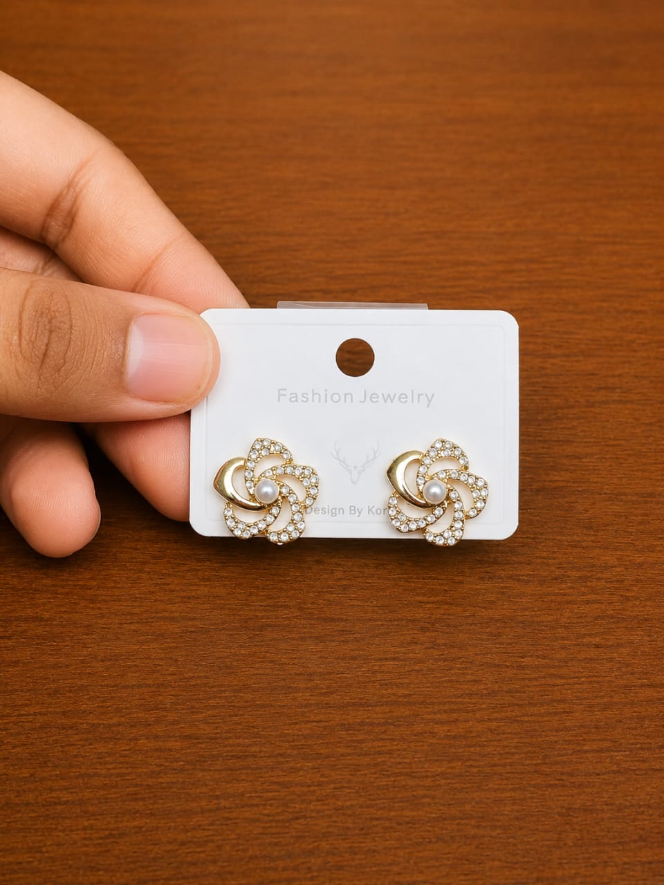 Swirl Stone Stud Earrings in silver-tone style with rounded swirl motifs outlined with clear accents