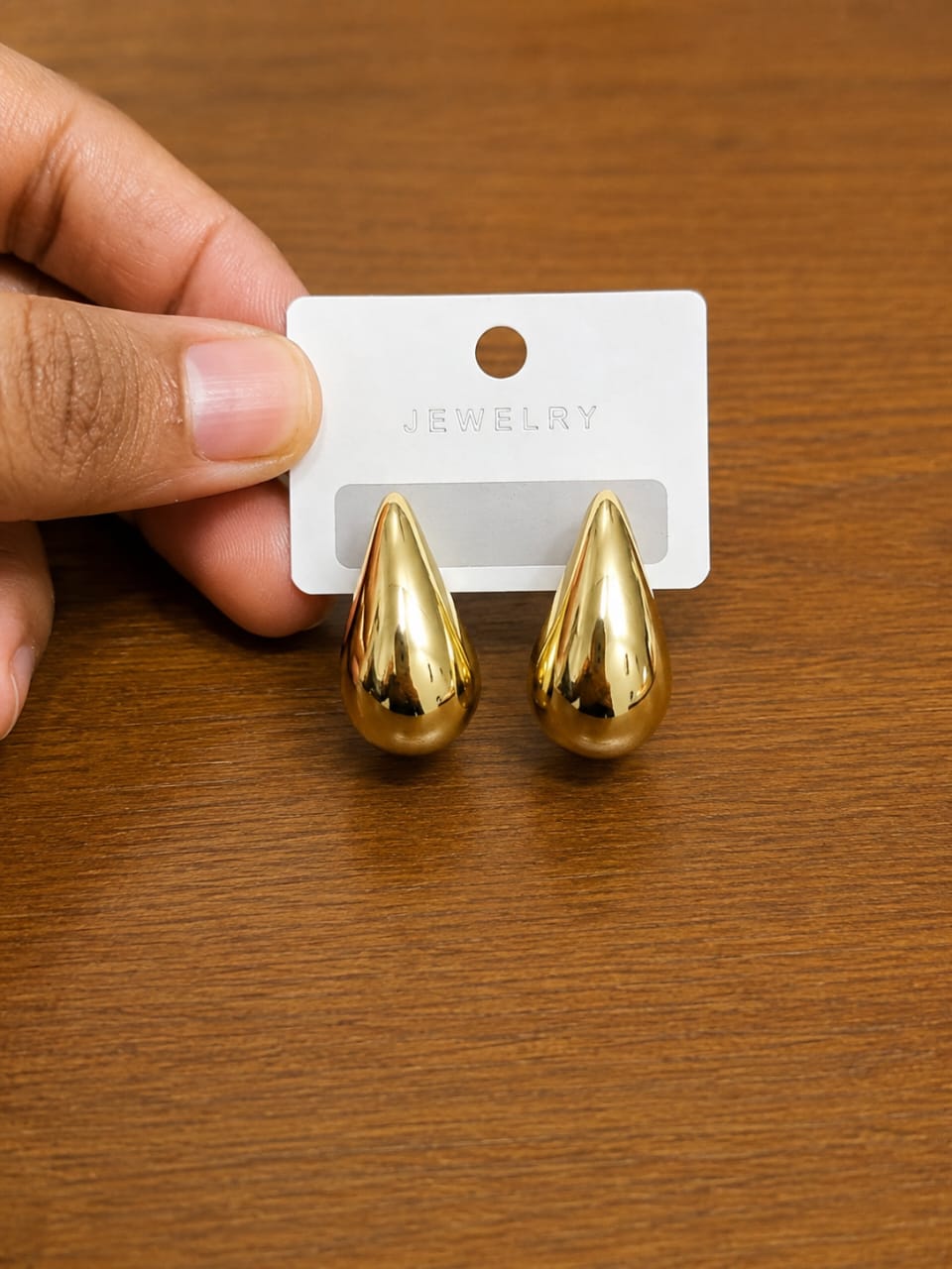 Gold Teardrop Stud Earrings in gold-tone style with smooth dimensional teardrop forms