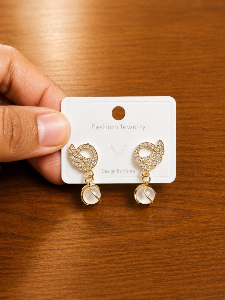 Leaf Clear Drop Earrings in gold-tone style with leaf-shaped clear frames with faceted hanging drops
