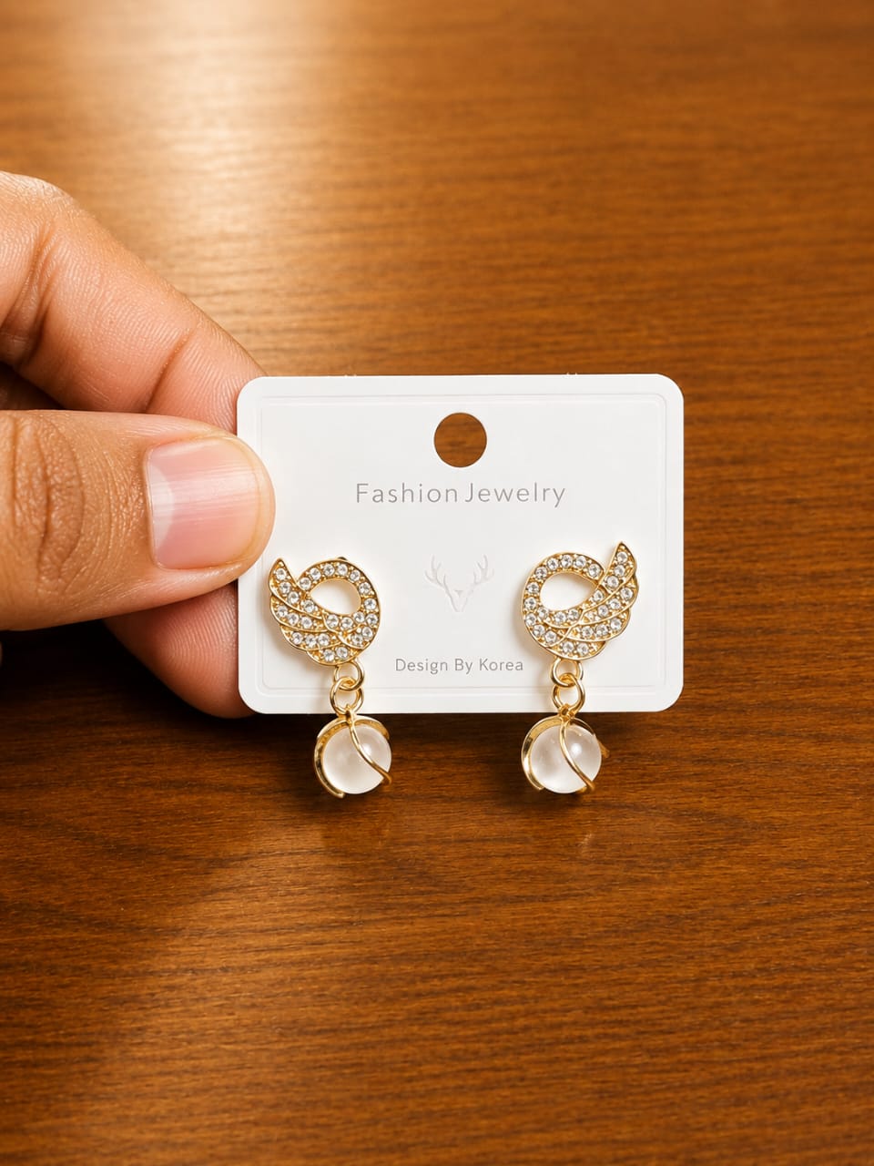 Leaf Clear Drop Earrings in gold-tone style with leaf-shaped clear frames with faceted hanging drops