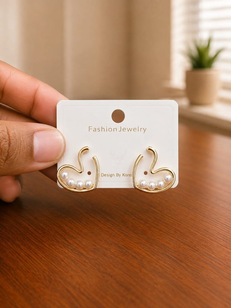 Swan Pearl Stud Earrings in gold-tone style with swan outlines with pearl-like body details