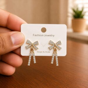 Bow Chain Drop Earrings in gold-tone style with clear bow tops with two fine hanging chains