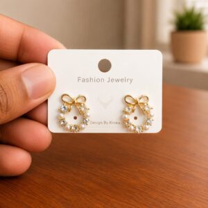 Bow Pearl Hoop Earrings in gold-tone style with bow-shaped hoops with pearl-like lower details