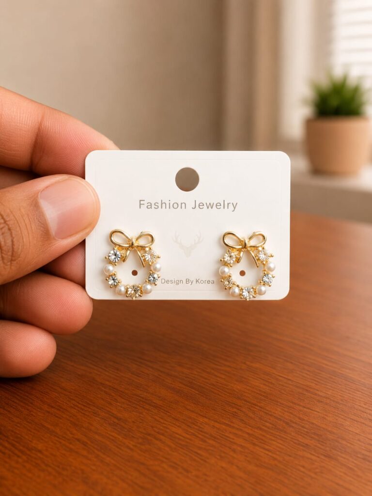 Bow Pearl Hoop Earrings in gold-tone style with bow-shaped hoops with pearl-like lower details