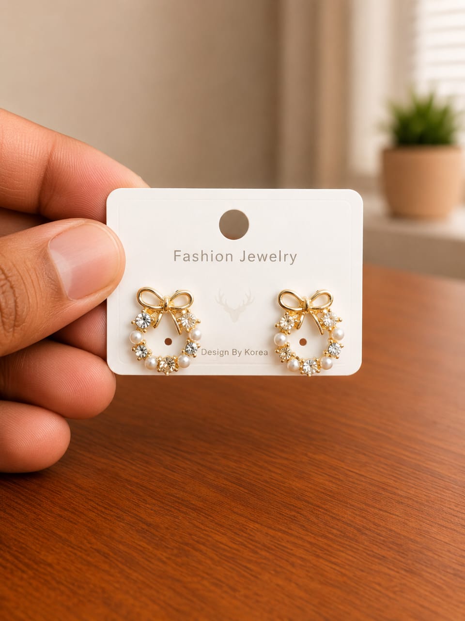 Bow Pearl Hoop Earrings in gold-tone style with bow-shaped hoops with pearl-like lower details