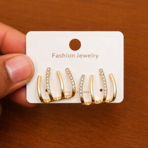 Triple Hoop Stud Earrings in gold-tone style with three graduated curved bars with clear inner rows