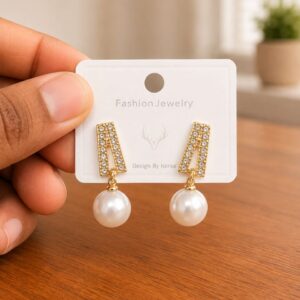 Bar Pearl Drop Earrings in gold-tone style with tapered clear bars with large pearl-like drops