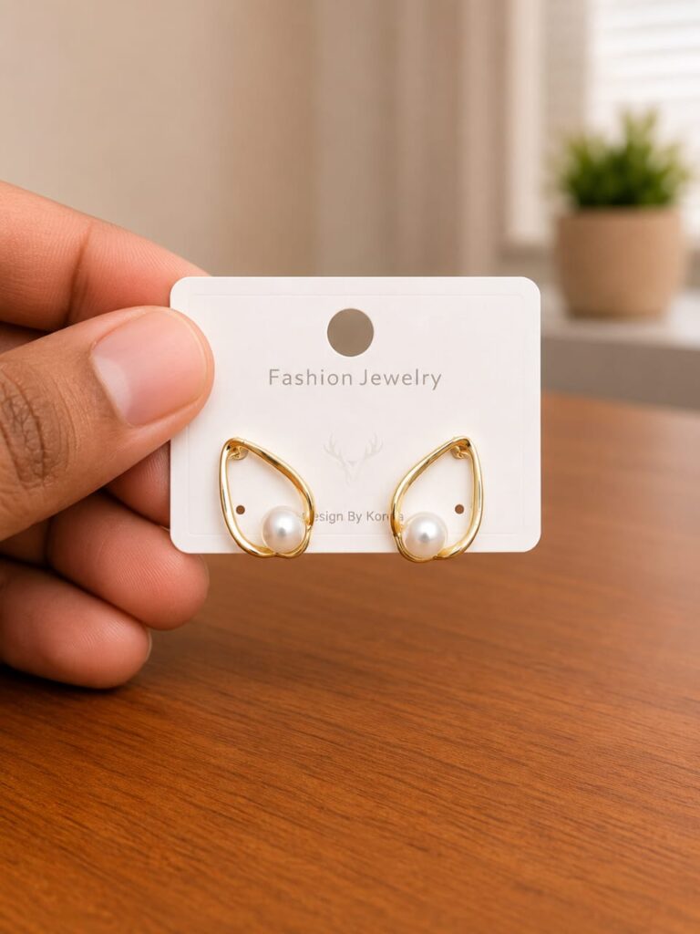 Open Frame Pearl Teardrop Stud Earrings in gold-tone style with pearl-like teardrop centres inside smooth open frames