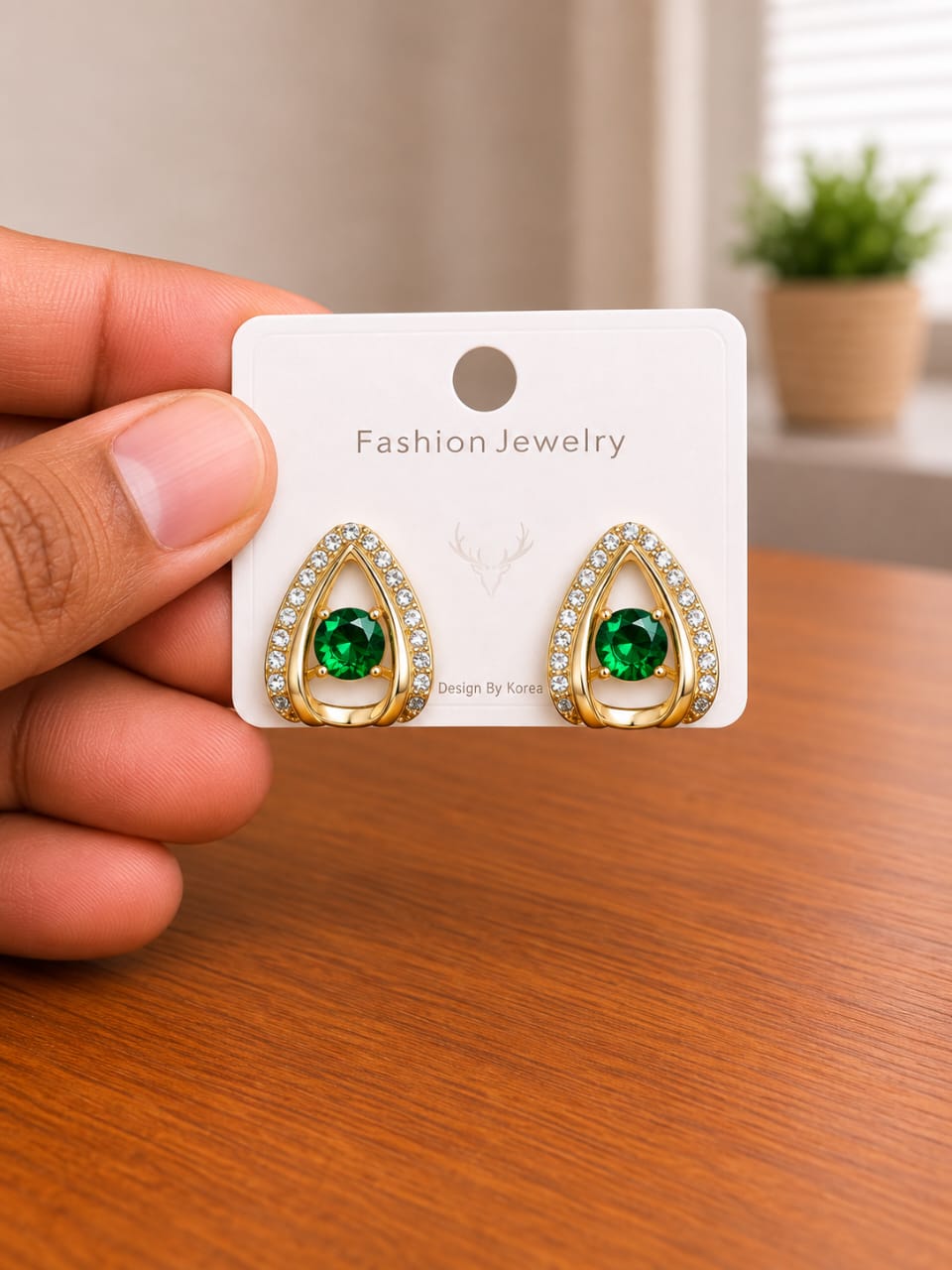 Green Stone Teardrop Stud Earrings in gold-tone style with green oval centres inside clear teardrop frames