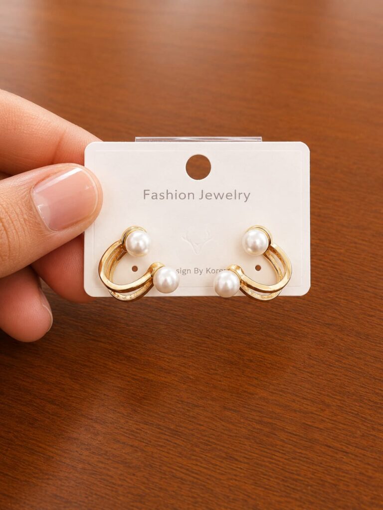 Pearl Double Hoop Stud Earrings in gold-tone style with pearl-like studs above two curved open hoops