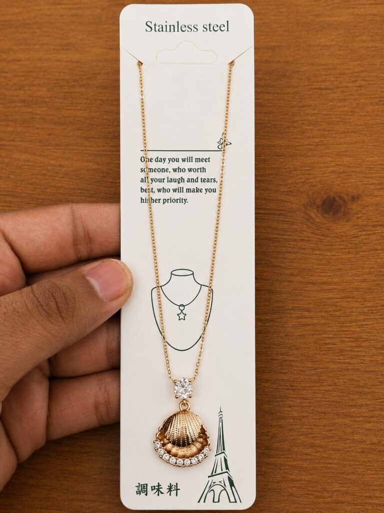 Gold-tone shell pendant necklace with clear stone accents