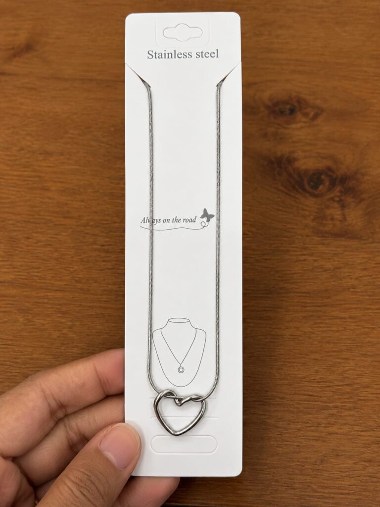 Silver-tone open heart pendant necklace with a double-outline design