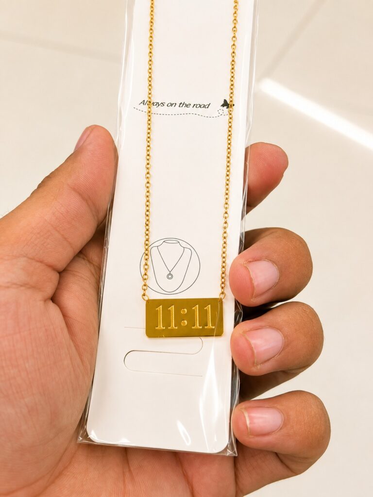 Gold-tone 11:11 necklace with a rectangular bar pendant