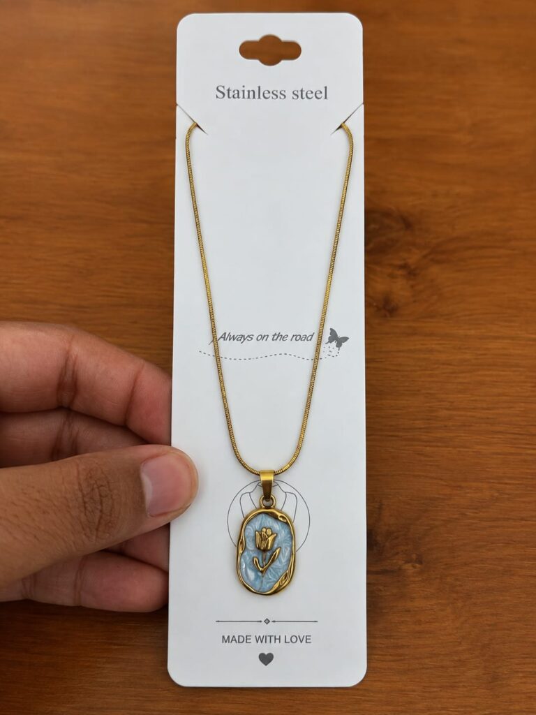 Gold-tone tulip necklace with a blue oval medallion